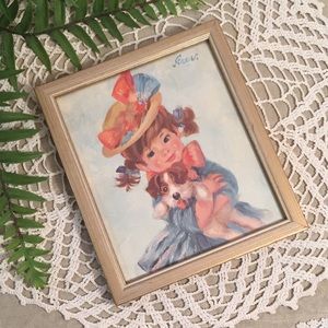 Vintage Girl Holding A Cute Puppy Framed Print